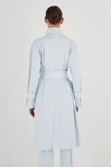Profile view of model wearing the Oroton Pocket Trench in Sea Glass and 99% Cotton, 1% Spandex for Women