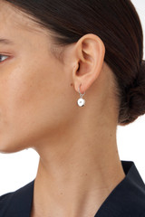 Profile view of model wearing the Oroton Fawne Circle Mini Hoops in Silver/Clear and Brass Base With Sterling Silver plating/Cubic Zirconia for Women