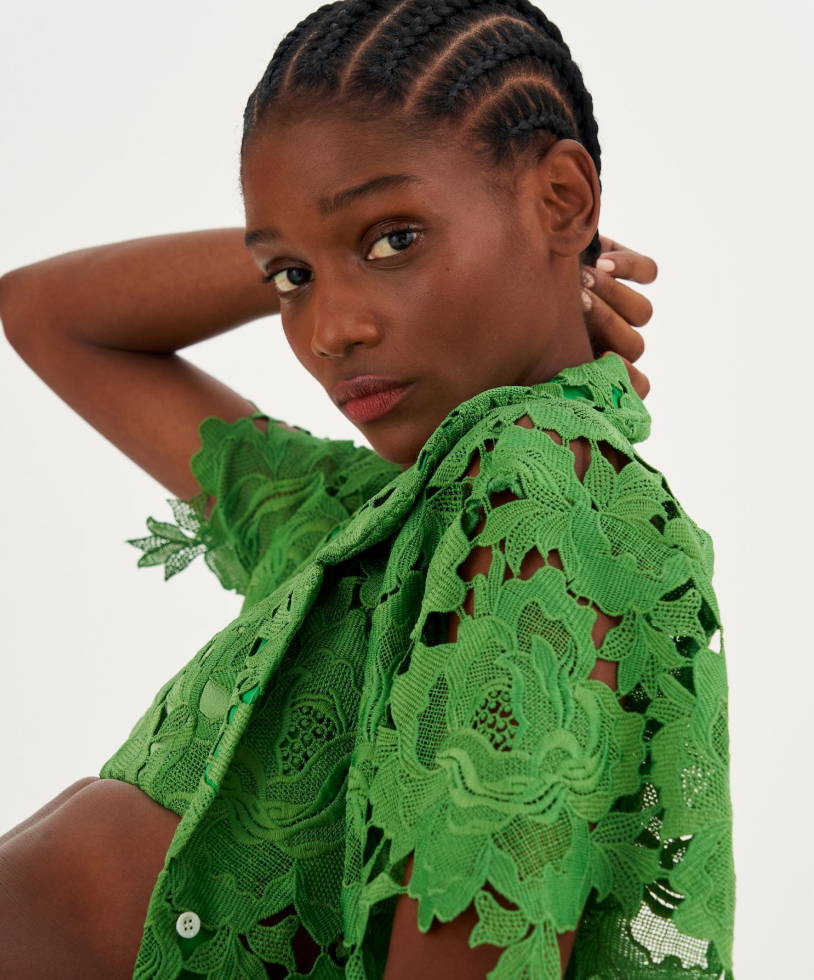Model wears Oroton Lace Camp shirt in green